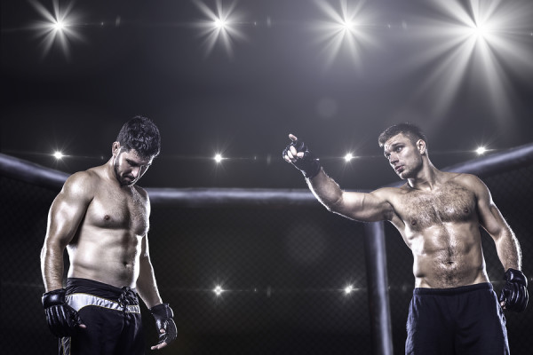 Two mma fighters in cage before fight